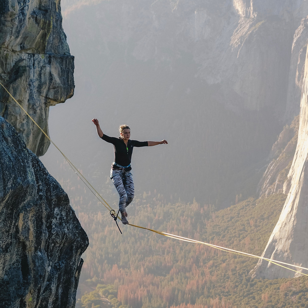 woman balancing on a tightrope
