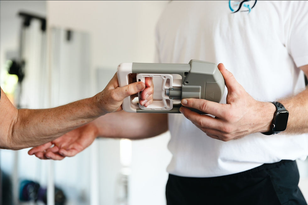 A lady squeezing a dynamometer