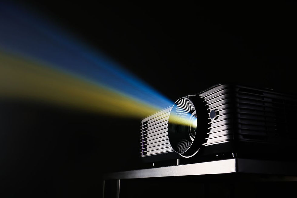 Projector casting blue and yellow light in a dark room