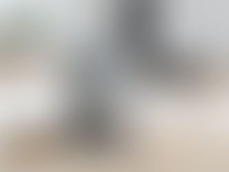 Home espresso machine set up on a kitchen counter with coffee cups