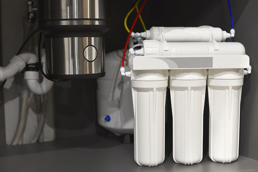 Under-sink reverse osmosis water filter system installed in a kitchen cabinet