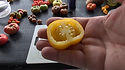 Here is the Plum Lemon Tomato, Solanum lycopersicum. This Plum Lemon Tomato was Collected by Kent Whealy from an elderly seedsman at Moscow’s Bird Market during the August 1991 coup. Originally from the Saint Petersburg area, This very firm lemon shaped 2 inch fruit with it's vivid yellow skin and mild lemony flesh is quite a heavy producer. It is considered a hollow tomato making it a good choice for a tomato sauce. Excellent in vegetable soup and for stuffing like a stuffed pepper! Plants get to over 4 feet tall with as many as 6 fruits per bract. Indeterminate, Open pollinated 75 days from transplant.