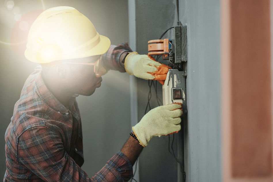 Portrait of a black man architect at a building site looking at camera. Confident civil en