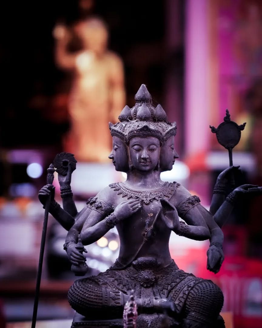 Bangkok temples are adorned with ancient sculptors representing calm and peace