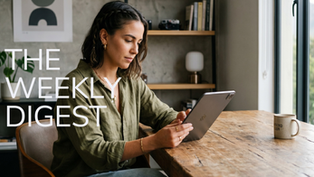 A realistic, professional-lifestyle photo of a digital content creator seated and fully engaged with a single, sleek handheld mobile device held in their hands.