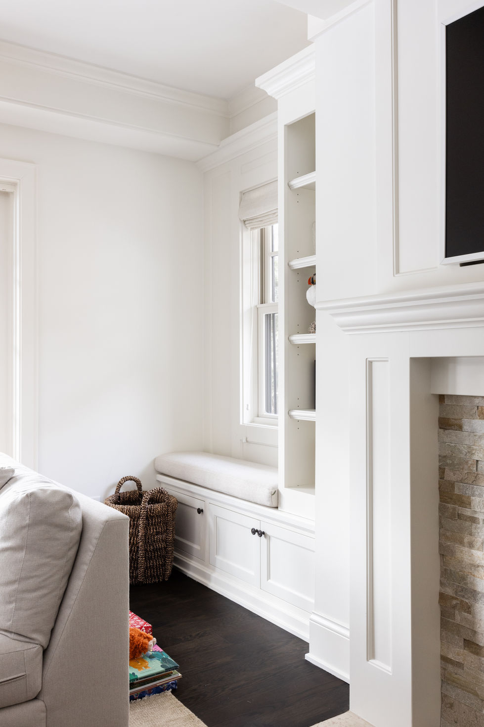 Edina Minnesota custom white painted ktichen with metal range hood, dark refinished wood floors, double ovens, commercial stainless range, island, raised tray ceilng with custom painted crown molding.