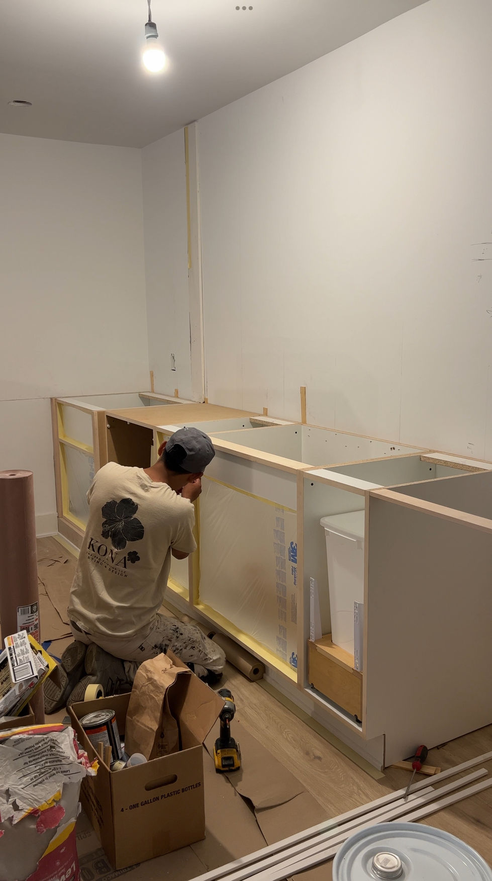 Interior house painter prepping cabinets in Edina