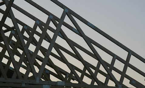 trusses being lifted on new home