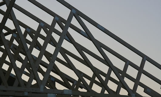 trusses being lifted on new home