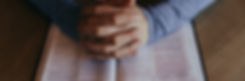Person praying with Bible