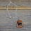Thumbnail: Red Orange Aventurine Stag Cave Painting Pendant with Chain.