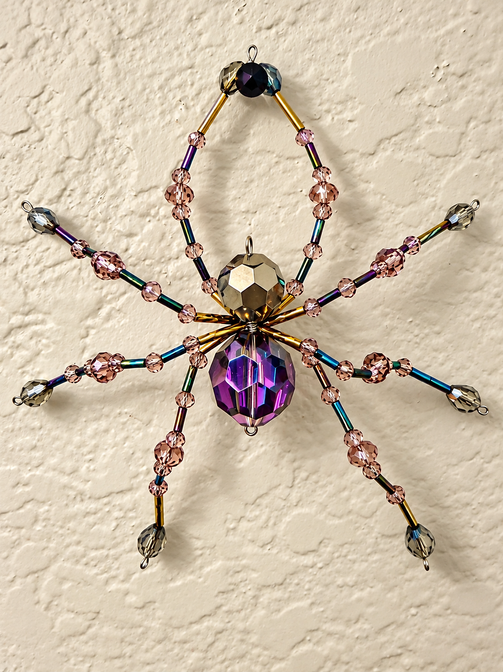 Thumbnail: Maude handcrafted pink, purple, iridescent and gold beaded spider by Fae Bella West, 5 x 5 inches