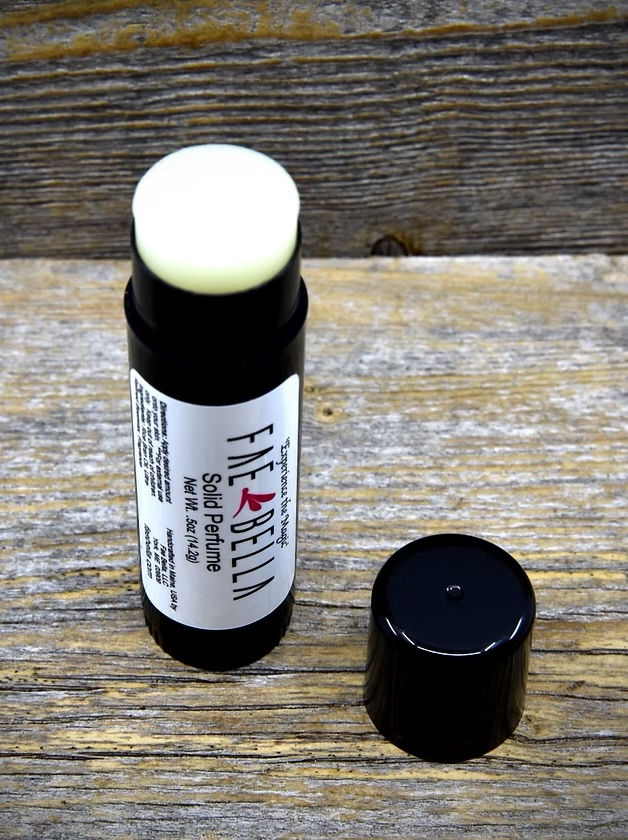 Thumbnail: Glade Glamour solid perfume by Fae Bella in black twist-up perfume tube, handcrafted in Maine USA