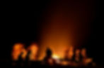 People sitting around a campfire