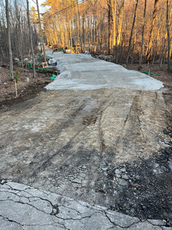 Gravel begins to go down on the road.
