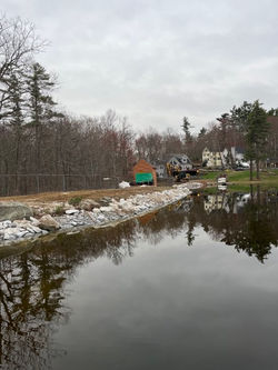 Fresh stone edging added to dam.