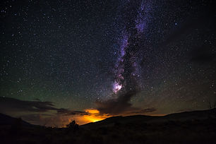 clouds across a starry night sky