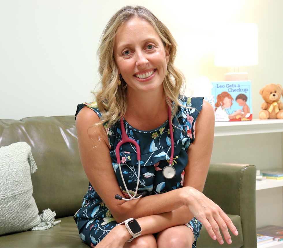 Dr. Ellie on a couch with her stethescope