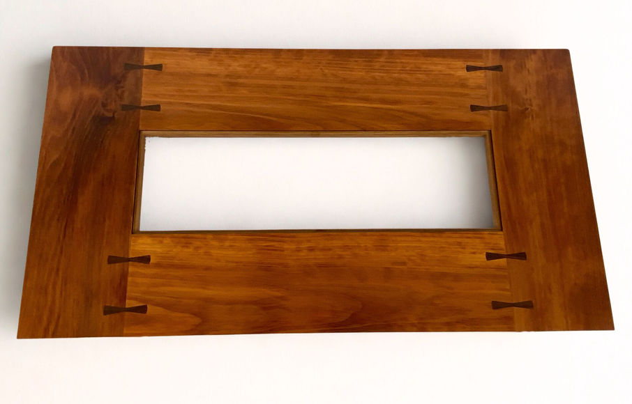 Craftsman coffee table with sculpted legs made from redwood, Douglas fir and madrone, with glass insert, top view showing butterfly joints