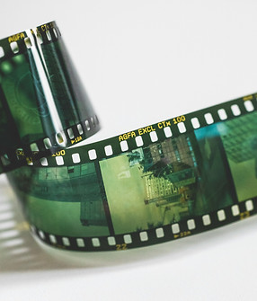 A film reel tinted in green.