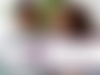 Smiling couple sits on a couch in a bright living room; text overlay reads Does Couples Therapy Work? with Authentic Living logo.