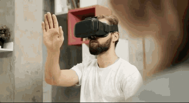 A person wearing VR trying to use various options in the virtual world