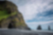 Reynisfjara Dangerous Black sand beach, basalt columns and sea stacks
