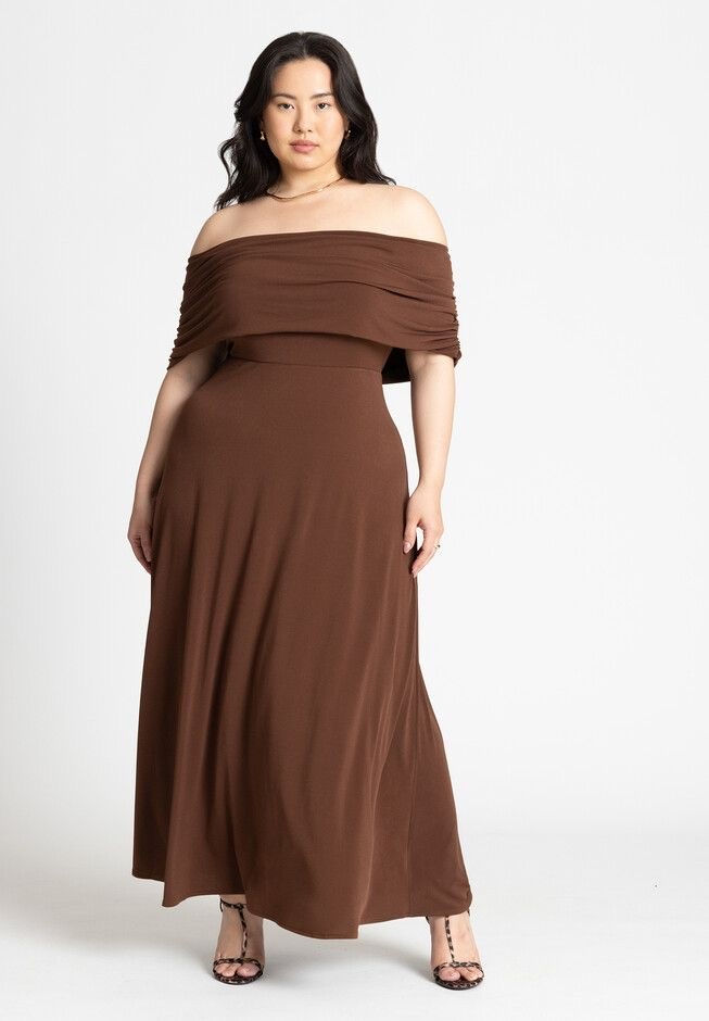 plus size woman in flowy brown shoulder-less cocktail dress