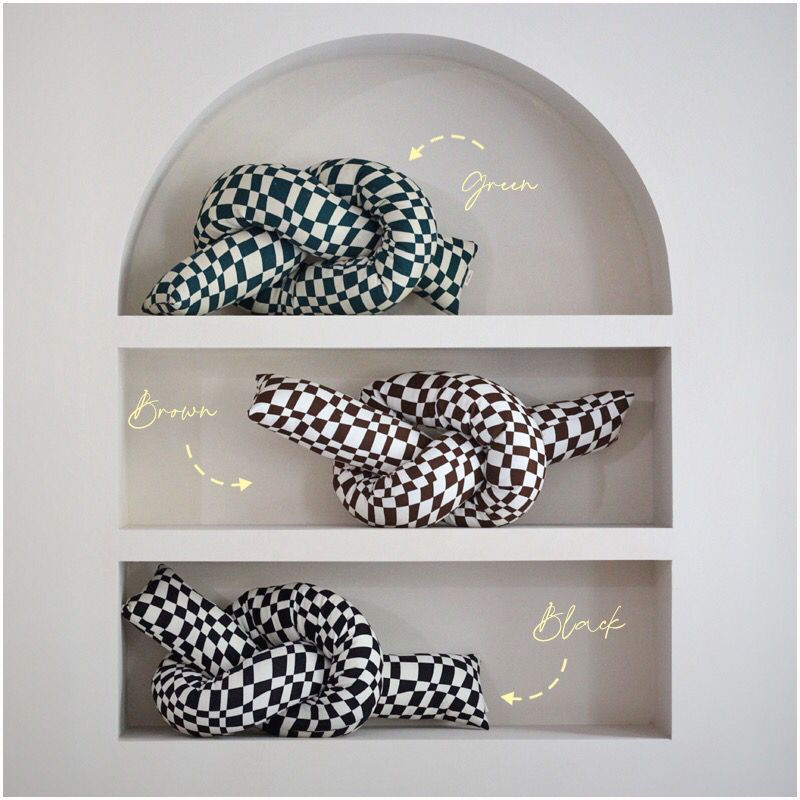 Thumbnail: checkered knot pillow