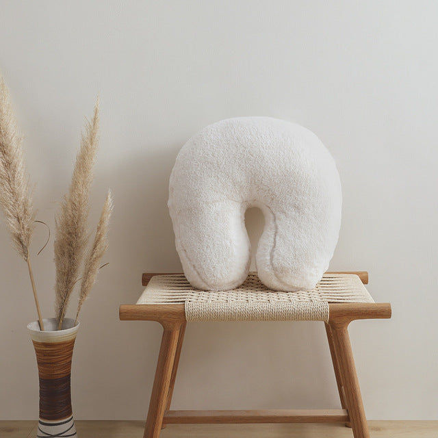 Thumbnail: a range of white throw cushion in lovely shapes