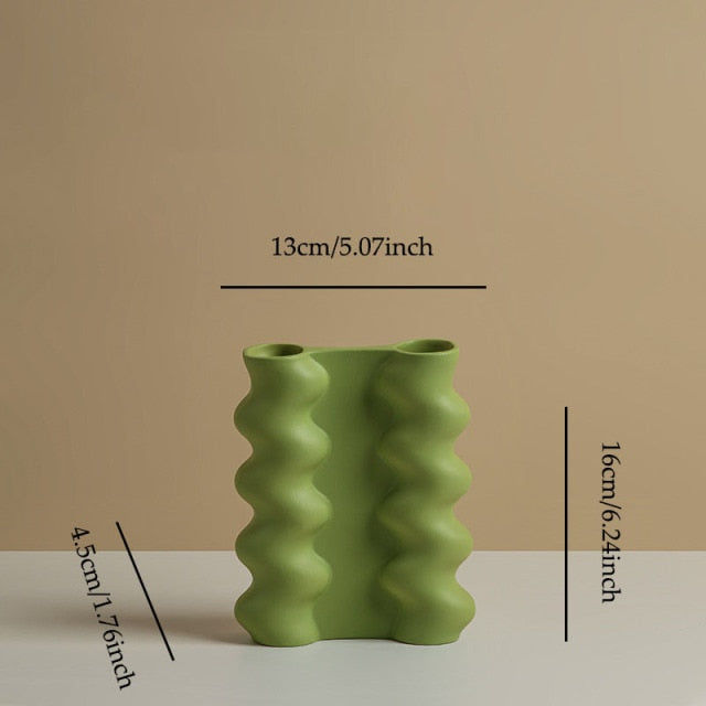 Thumbnail: geometric sculpture vases