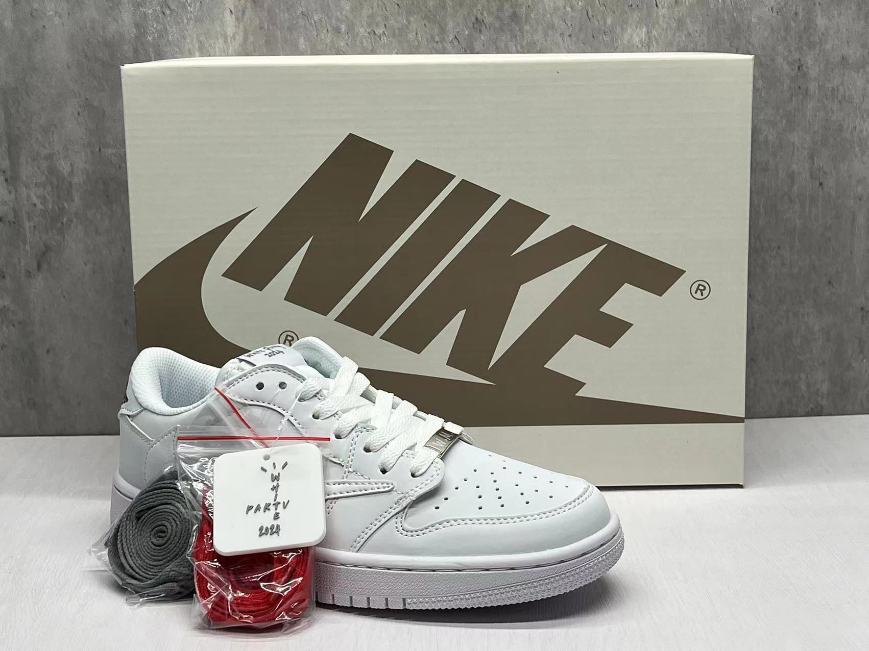 x Travis Scott  “Triple White”