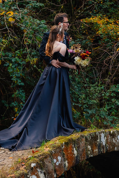 Couple stood on a moon bridge in Sunnyhurst Wood Darwen
