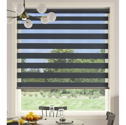 Zebra blackout blind in a dining room window allowing natural light
