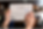 A woman's hand holding a tablet on which google search page is open