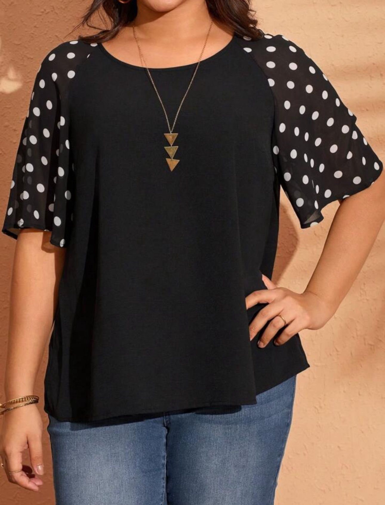 Blusa negra con mangas con print de lunares