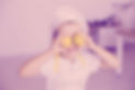 child%20in%20white%20polo%20shirt%20holding%20yellow%20fruit_edited.jpg