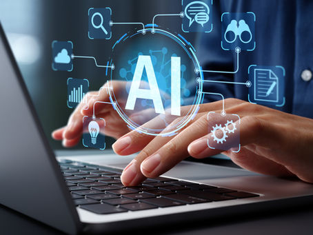 Person using laptop with holographic AI symbols.