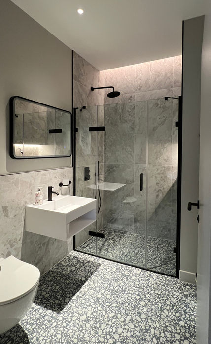 Modern family bathroom black, white glass, terrazzo tiling