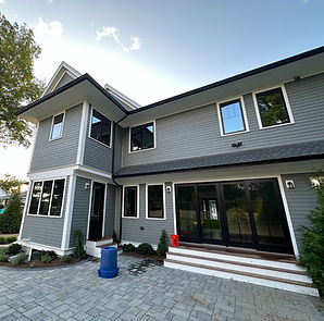 House with freshly cleaned exterior windows by Exterior Property Experts.