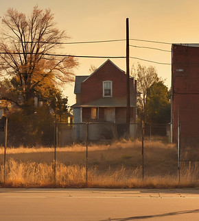 vacant lot in a run down neighborhood viewed from the street..jpg