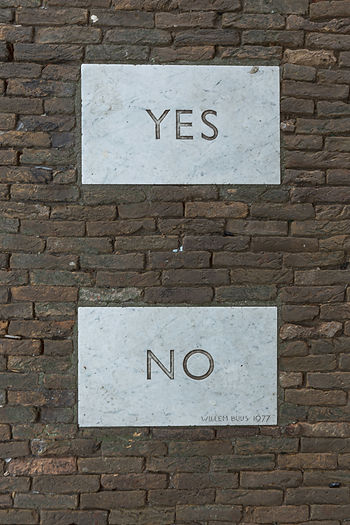 Bricks that read "yes" and "no" to indicate the strategic no in boundary setting