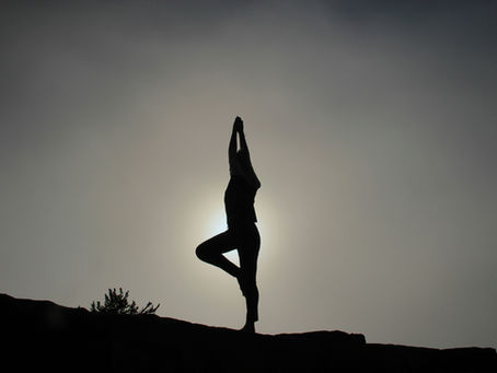 Image of person doing yoga to represent alignment and awareness needed to lead self and others