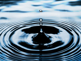 Water droplet creating a ripple in the water to signify the impact of leadership and our leadership lessons over the past 9 years