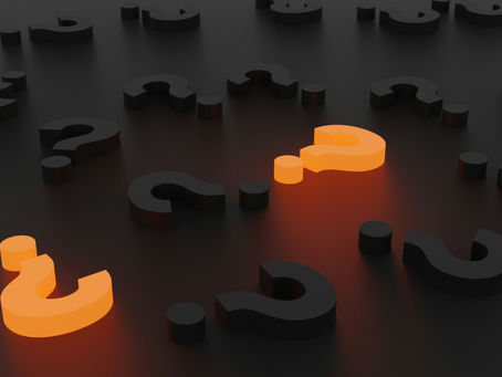 several 3D question marks in black and 2 in bright orange to signify the quiet question most leaders don't dare ask