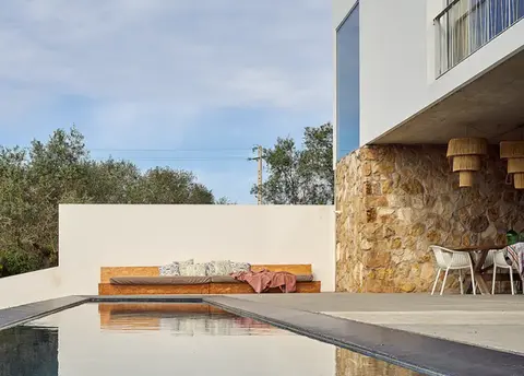 Outdoor pool and dining at our luxury surf villa in Portugal