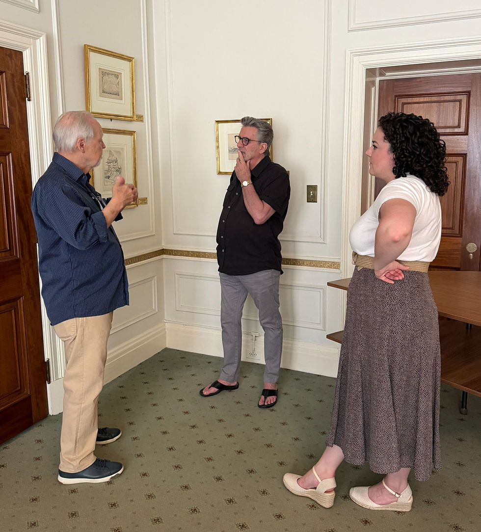 Roald, Paul, and Kaitlin discussing important Lawren Harris sketches in the Club.