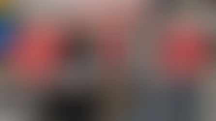 Quantum Land Design team at ConExpo-Con/AGG booth, promoting GPS models and drone data solutions for earthmoving and construction technology ahead of ConExpo 2026.