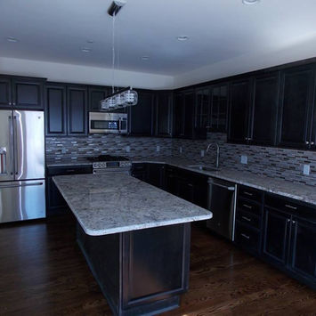 Dark Kitchen with White Countertop