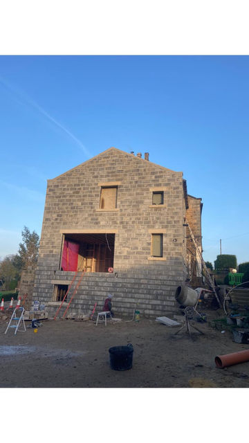 A side extension on a house spanning over three levels. Build in matching stone work to compliment the original structure. 